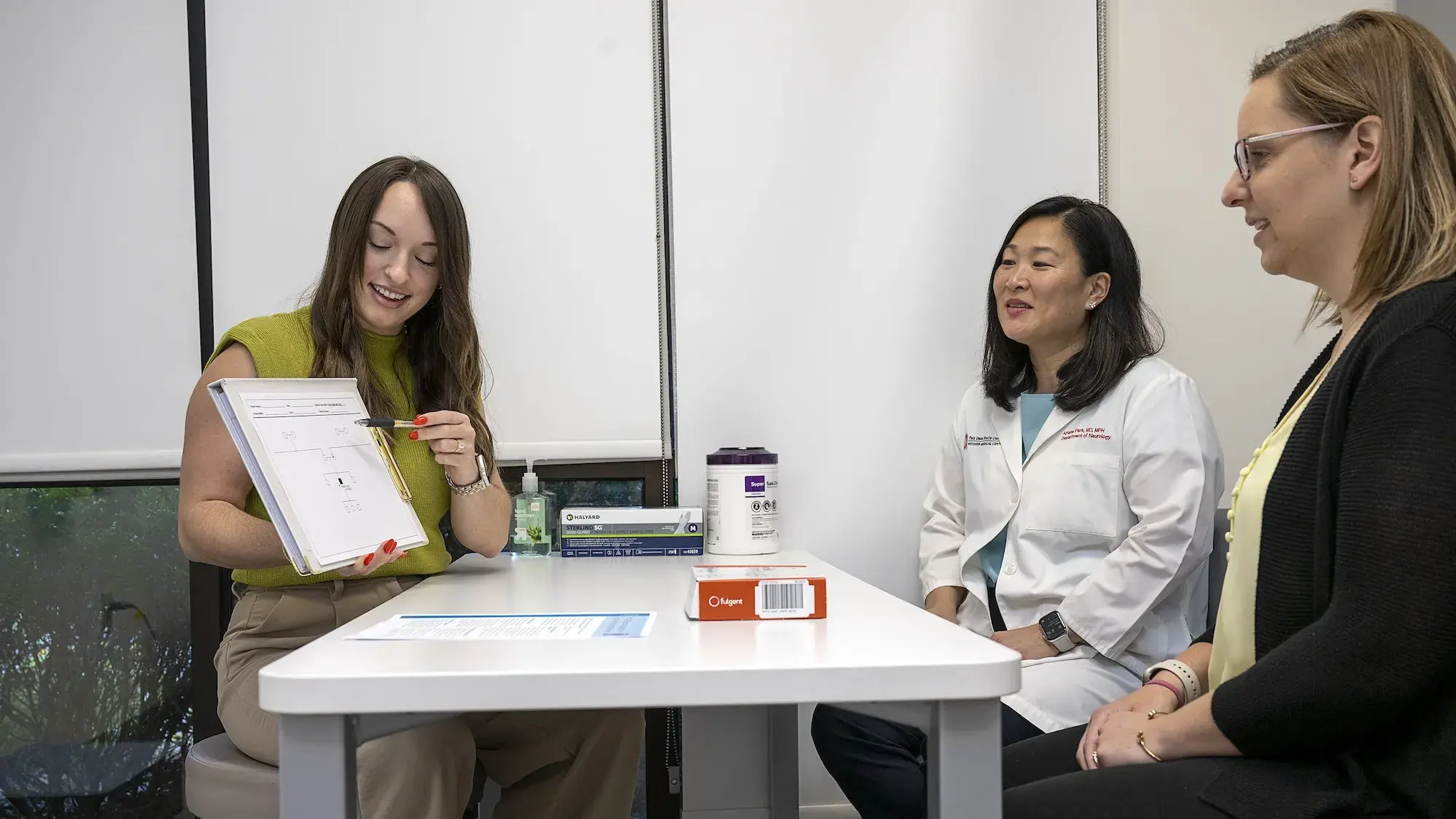 Woman presenting to mentors