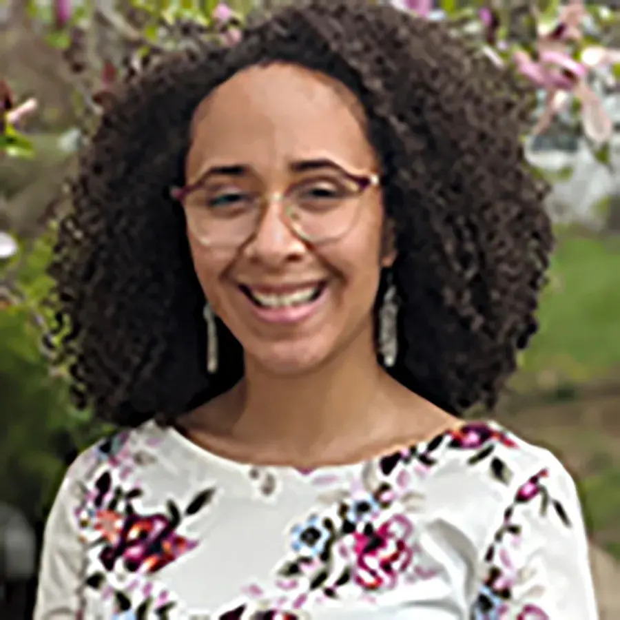 portrait of Jasmine Neal wearing a white flowered shirt outdoors