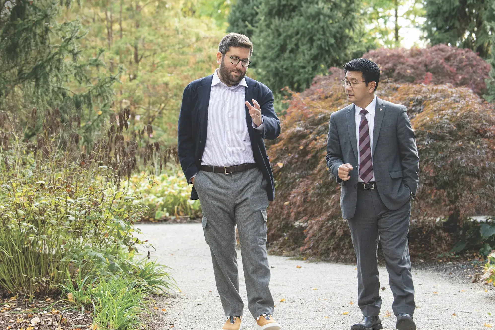 Two men walking outside